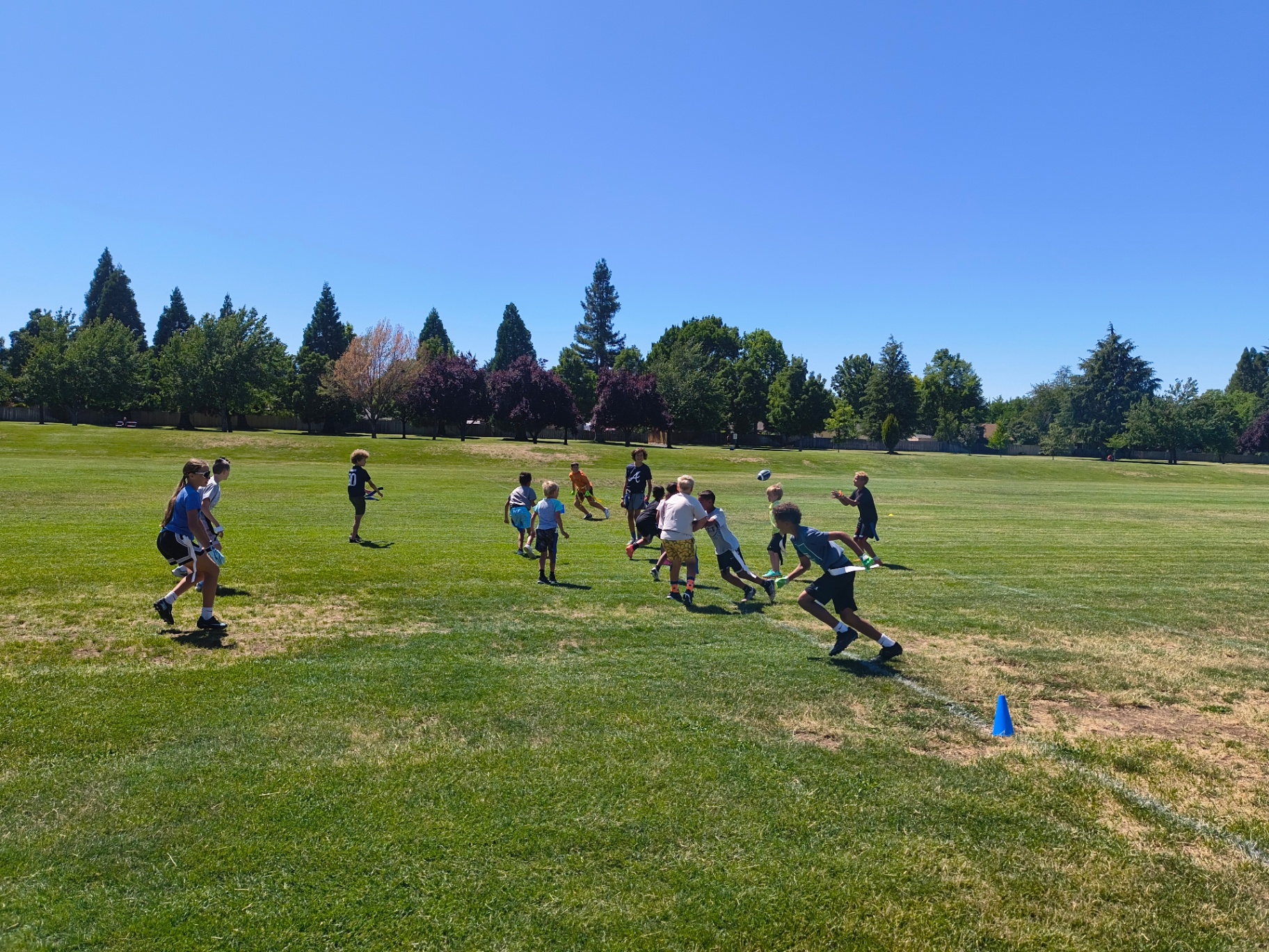 Recreation Academy campers lining up for flag football